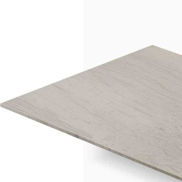 Beige marble countertop edge extending diagonally across the image, viewed from above.