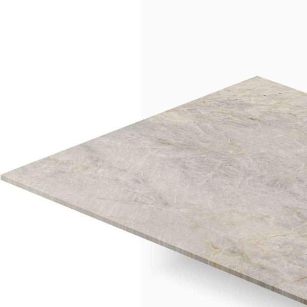 Corner view of a beige marble countertop edge extending toward the viewer against a white background.