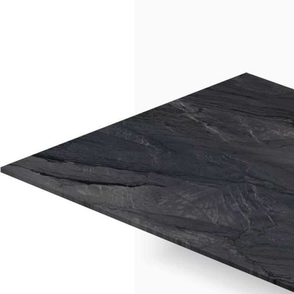 Angled view of a dark marble tabletop with subtle white veining against a white backdrop.