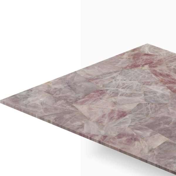 Pink marble tabletop angled away, showing pink, gray and white veining.