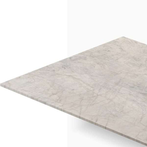 Edge of a light gray marble countertop with subtle veining, shown from a corner. (informative)