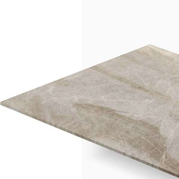 Close-up of a beige marble countertop edge viewed from above in a diagonal perspective