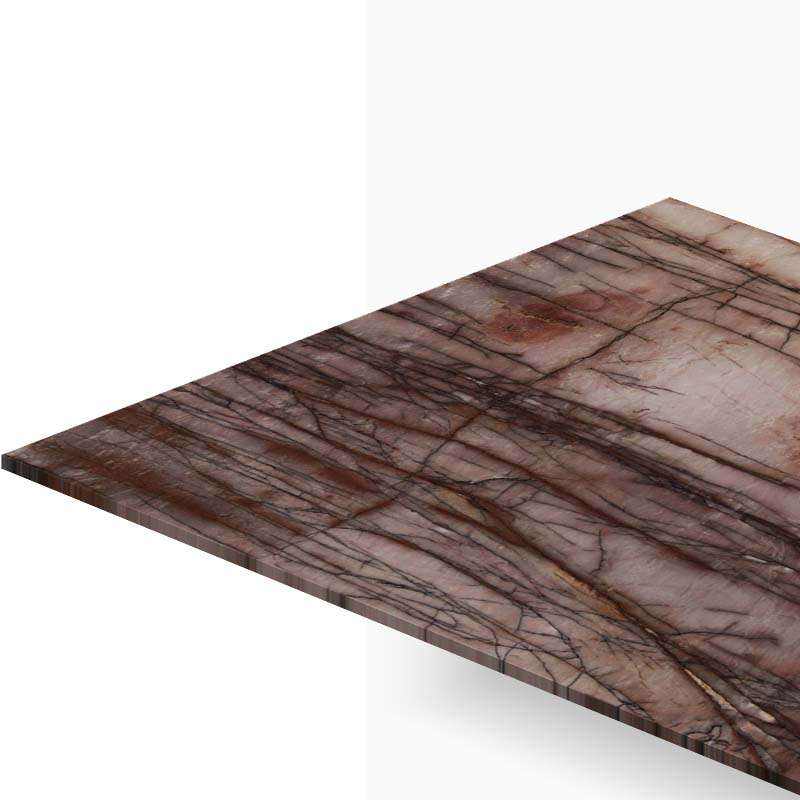 Pink marble tabletop with dark veining, photographed at an angle to show depth and edge.
