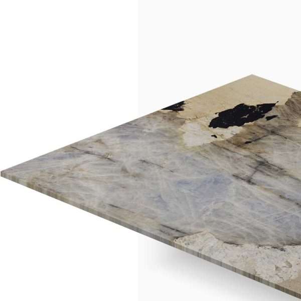 Corner of a marble-style tabletop with gray, beige, and black veining seen from an angled perspective.
