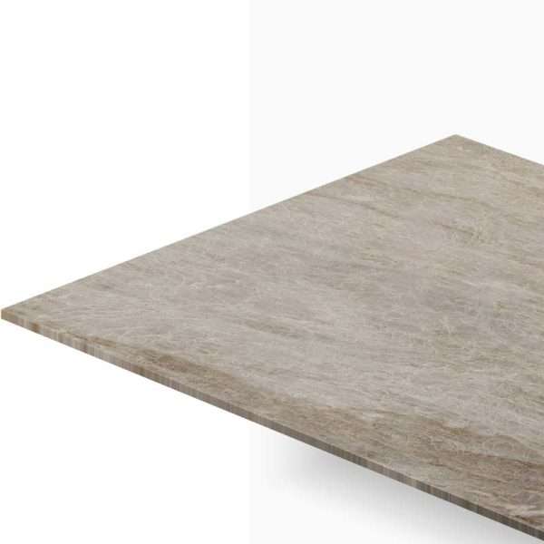 Close-up of a beige marble countertop edge extending toward the viewer against a white background.
