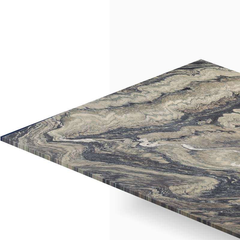 Close-up of a marble-patterned tabletop edge viewed at an angle, showing grey-beige swirls and a sharp corner.