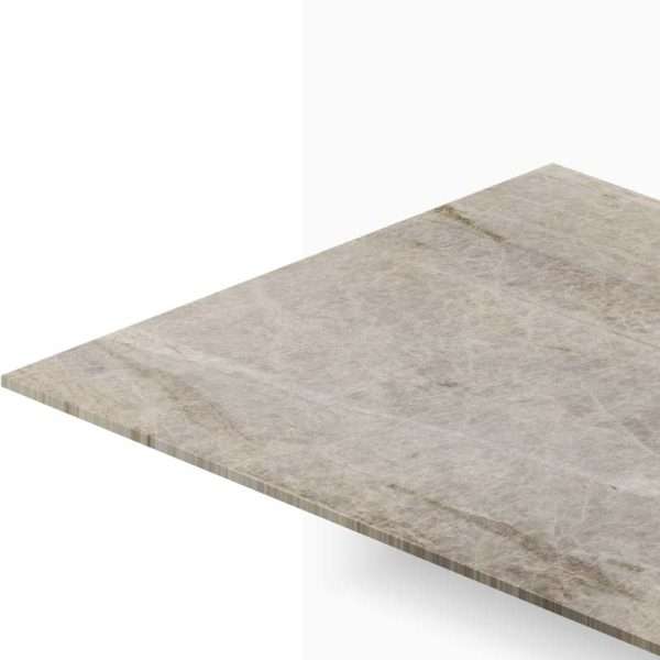 Diagonal view of a beige marble tabletop edge against a white background, showing subtle veining and texture.