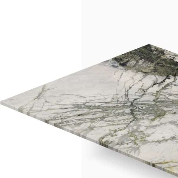 Marble countertop edge with gray and green veining shown from an angled perspective.