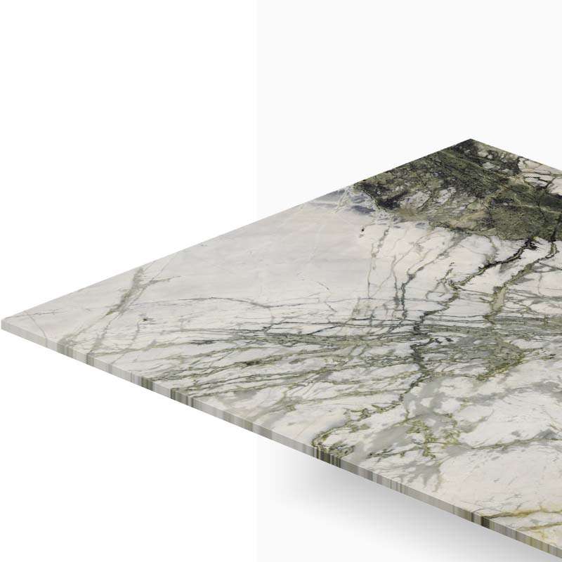 Marble countertop edge with gray and green veining shown from an angled perspective.