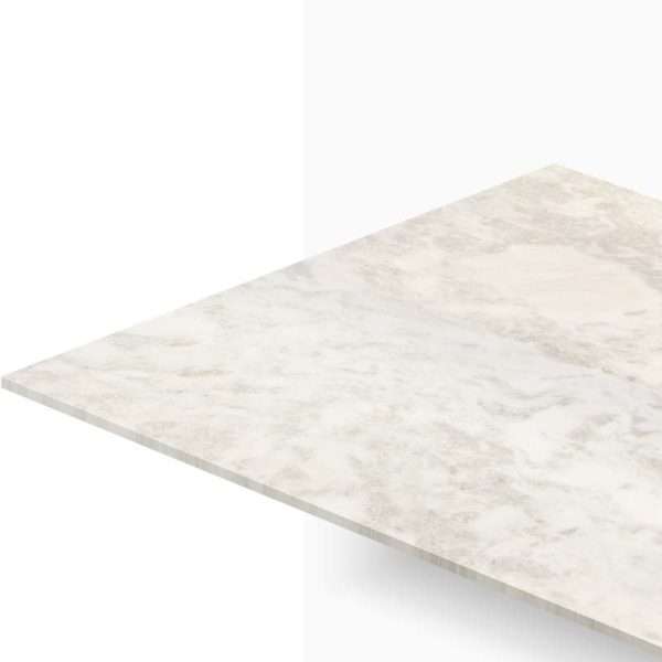 Diagonal view of a light marble countertop with subtle gray veining and a beveled edge extending toward the bottom left.