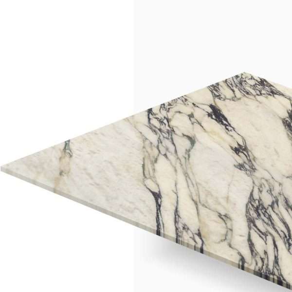 Cream marble countertop wedge with bold dark veins, shown against a white background.
