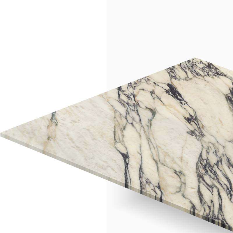 Cream marble countertop wedge with bold dark veins, shown against a white background.