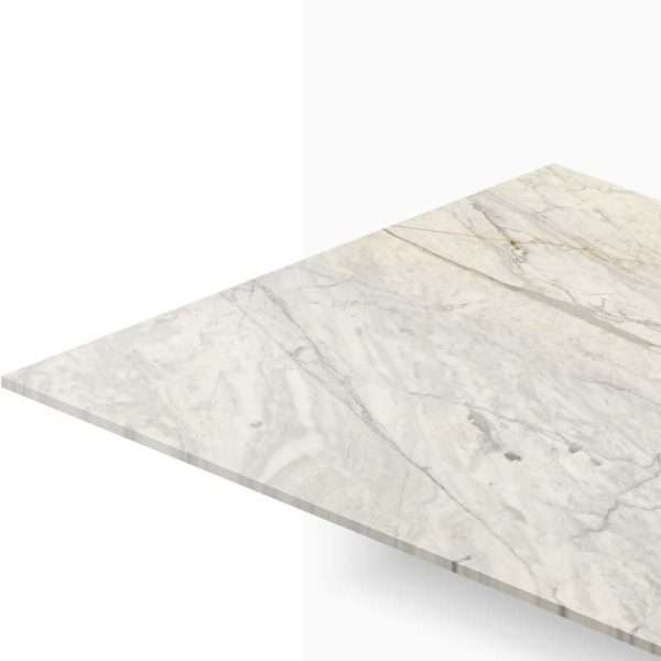 Angled view of a white marble countertop with gray veins and a straight edge edge to the left outside the frame.