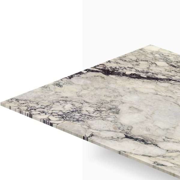 Diagonal view of a marble countertop slab with gray and black veining.”,