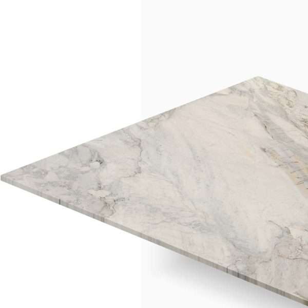 Close-up of a white marble countertop with subtle gray veining and a triangular edge edgewise visible from above.